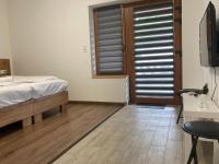 Tweepersoonskamer met 1 of 2 Bedden en een Terras