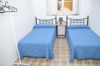 Camera Doppia con Letti Singoli e Bagno in Comune