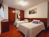 Camera Doppia con Letti Singoli con Vista Giardino