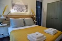 Kamer met Queensize Bed en Uitzicht op de Tuin