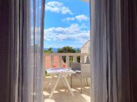 Doppelzimmer mit Balkon und Meerblick