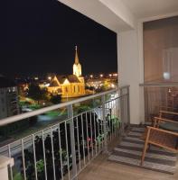 One-Bedroom Apartment with Balcony and City View