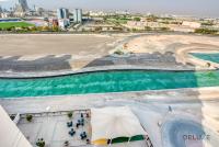 Sunny 1BR at Canal Residences West Dubai Sports City by Deluxe Holiday Homes - Chambres d'hôtes Dubaï