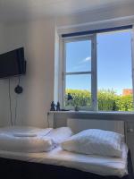 Camera Doppia con Letti Singoli e Bagno in Comune