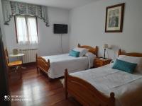 Camera Doppia con Letti Singoli e Bagno in Comune