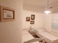 Capo Figari 9, Appartamento spazioso nel centro di Golfo Aranci con terrazza, Wi-Fi, parcheggio gratuito - Chambres d'hôtes Golfo Aranci