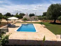 TRULLO PARCOMONSIGNORE CON PISCINA PRIVATA - Ferienwohnung