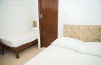 Cama individual en habitación compartida