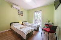 Habitación Doble con balcón (2 adultos + 1 niño)