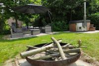 Vrijstaande 6 persoons Bungalow hottub en pizzaoven op vakantiepark - B&B Ewijk
