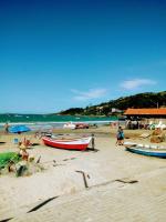 Casa aconchegante térrea à 3min de carro do centro e praia central - Chambres d’hôtes Garopaba