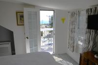 Queen Room with Balcony and Partial Ocean View #302