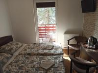 Doppel-/Zweibettzimmer mit Balkon