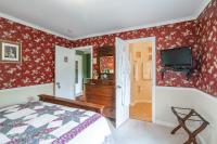 Zimmer mit Queensize-Bett und Gartenblick