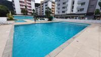 Apartamento com piscina em Ubatuba perto da praia - Chambres d'hôtes Ubatuba