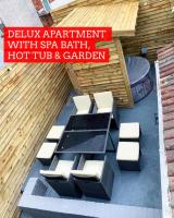 Delux apartment with hot tub in garden