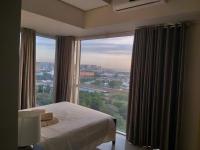 B&B Manila - De Luxe, Standard and Studio Suites -The Breeze Residences-close to Airport,Mall of Asia, US Embassy - Bed and Breakfast Manila