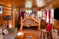 Zimmer mit Queensize-Bett und Whirlpool-Badewanne