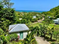 B&B Deshaies - Le Surf Lodge, chambre avec vue mer dans un écrin de verdure - Bed and Breakfast Deshaies