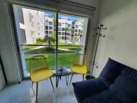 Departamento en planta baja, frente a la alberca y terraza, aire acondicionado total y WIFI - Chambres d'hôtes Manzanillo