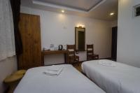 Tweepersoonskamer met 1 of 2 Bedden en Uitzicht op de Tuin