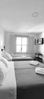 Camera Familiare con Bagno in Comune