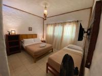 Chambre Triple avec Salle de Bains Privative