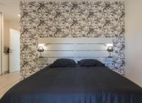 Zimmer mit Queensize-Bett und Gartenblick