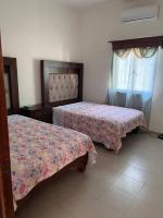 Flores Condominios Depa Lili - Chambres d’hôtes Álamos