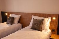 Tweepersoonskamer met 2 Aparte Bedden