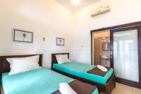 Camera Deluxe Doppia con Letti Singoli