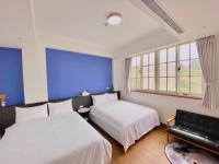 Camera Quadrupla con Vista Giardino 