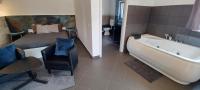 Kamer met Kingsize Bed en Bubbelbad - Sauna en Terras