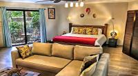 Pokoj typu Deluxe s manželskou postelí velikosti King a terasou 
