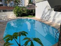 Apartamento Praia das Astúrias, 2 minutos de caminhada para praia, piscina, garagem demarcada, cama Queen - Chambres d'hôtes Guarujá