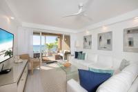 The Beachcomber - Three Bedroom Ground FL Oceanfront Condos by Grand Cayman Villas & Condos