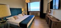 Kamer met Queensize Bed en Uitzicht op Zee
