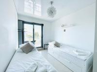 One-Bedroom Apartment with Balcony and Lateral Sea View