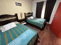 Chambre Quadruple avec Salle de Bains Commune