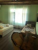 Camera Tripla con Vista Giardino