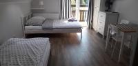 Dreibettzimmer mit Balkon