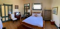Kamer met Queensize Bed en Uitzicht op de Tuin