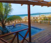 B&B Tela - Villa Devonia - Beachfront Cabins with Pool at Tela, HN - Bed and Breakfast Tela