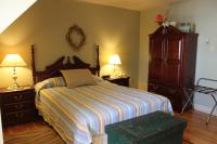 Zimmer mit Queensize-Bett und Gartenblick