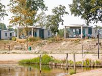 Chalet with a view of the beach or harbour, in a holiday park on the Leukermeer