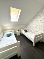 Camera Doppia con Letti Singoli e Bagno in Comune