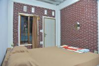 Chambre Deluxe (2 Adultes + 1 Enfant)