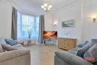 B&B Londen - OnSiteStays - Tranquil 2 Bedroom Apartment with Large Kitchen, Private Garden near Wimbledon Station - Bed and Breakfast Londen