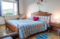 Kamer met Kingsize Bed en Uitzicht op de Bergen