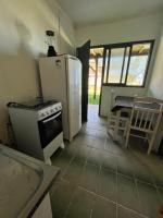 Room with one double bed and one single bed.